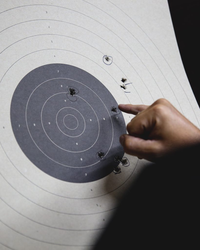 Pistol bullseye target shooting training in an indoor shooting club